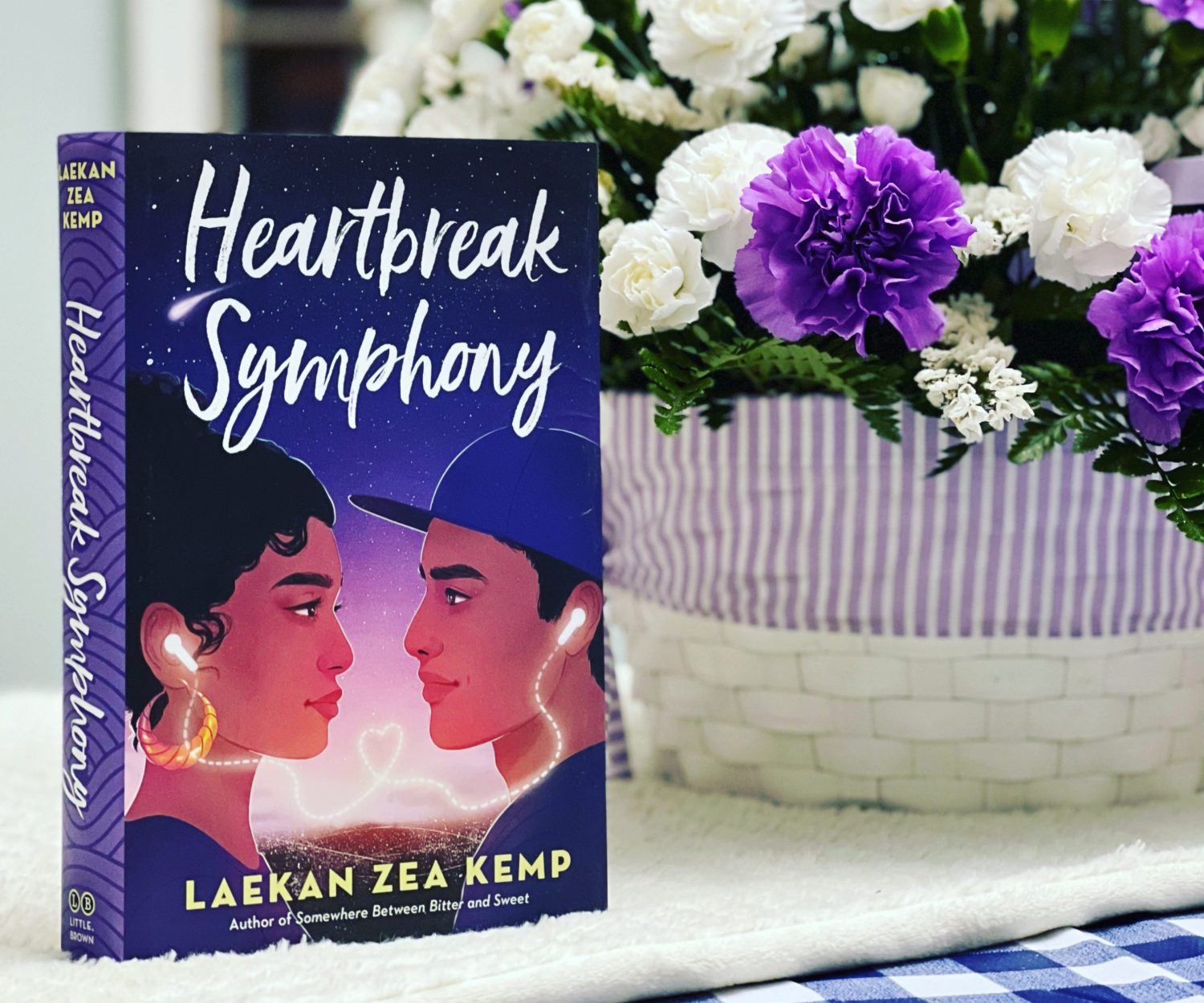 Book cover of Heartbreak Symphony with some flowers