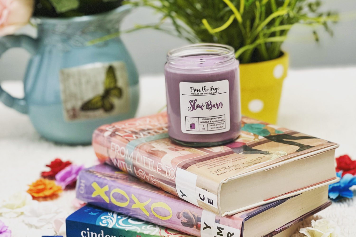 Book stack with flowers and a candle