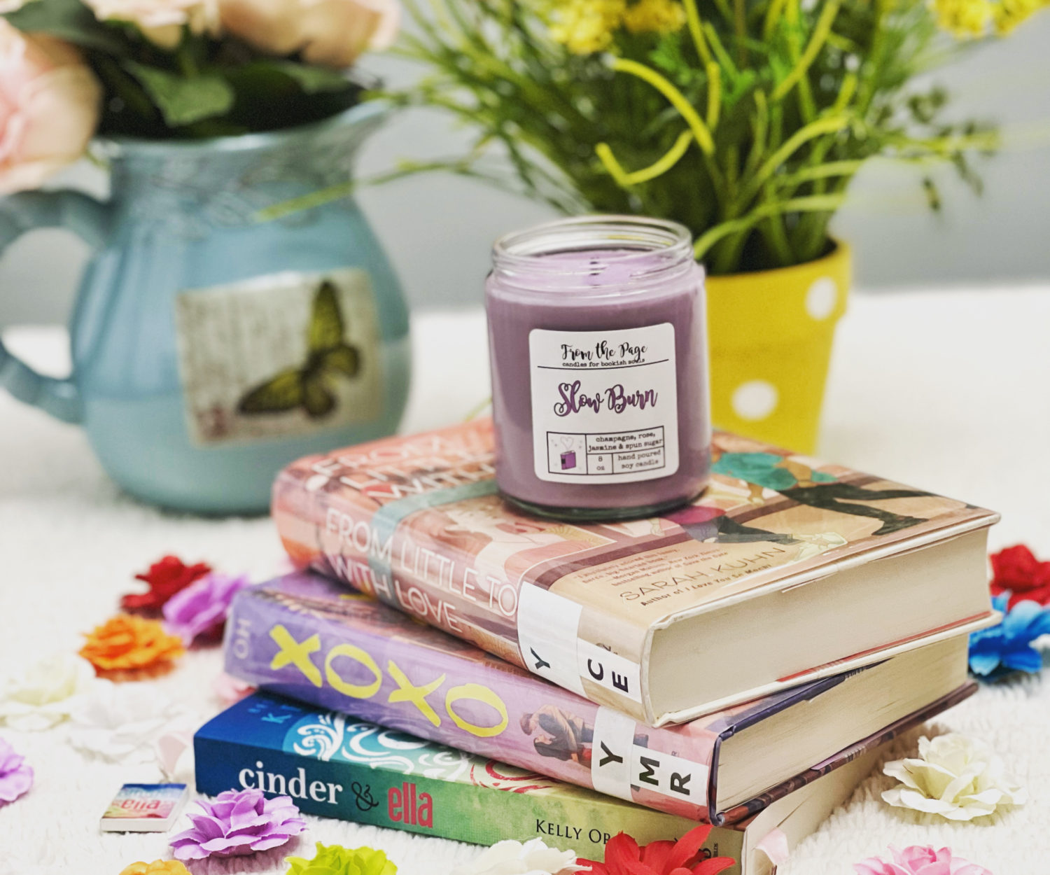 Book stack with flowers and a candle