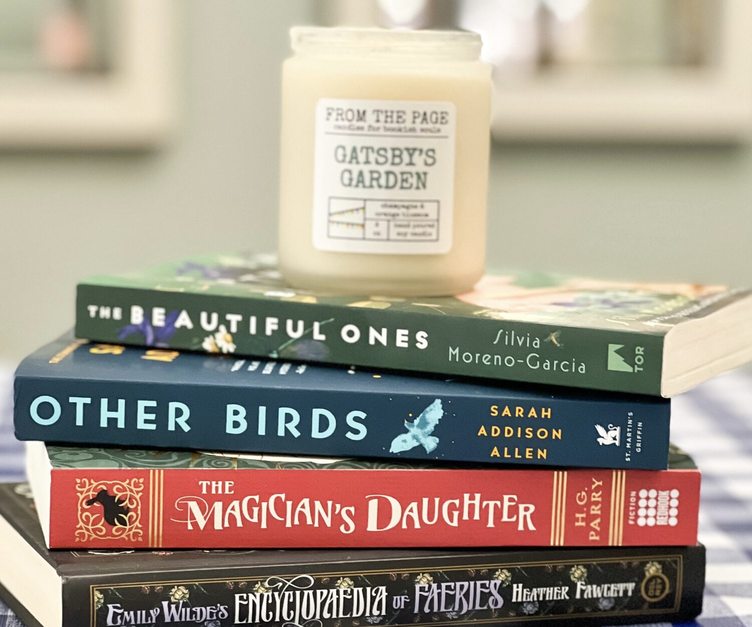 A stack of cozy fantasy books